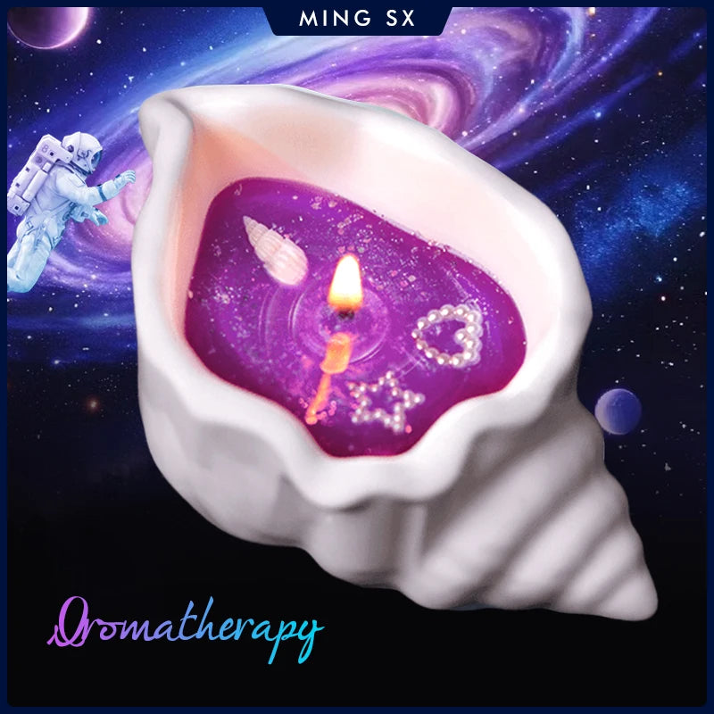 White seashell-shaped candle holder with sparkling purple wax, featuring decorative pearl heart and star charms.
