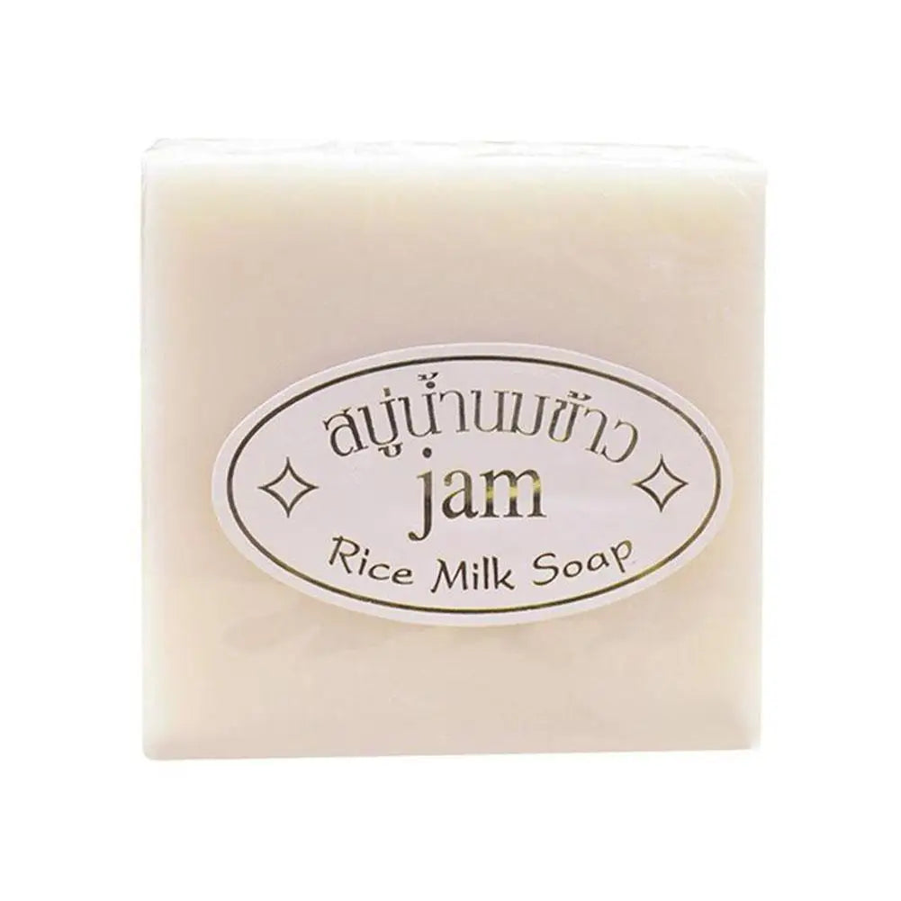 Square block of creamy white rice milk soap with an oval product label.
