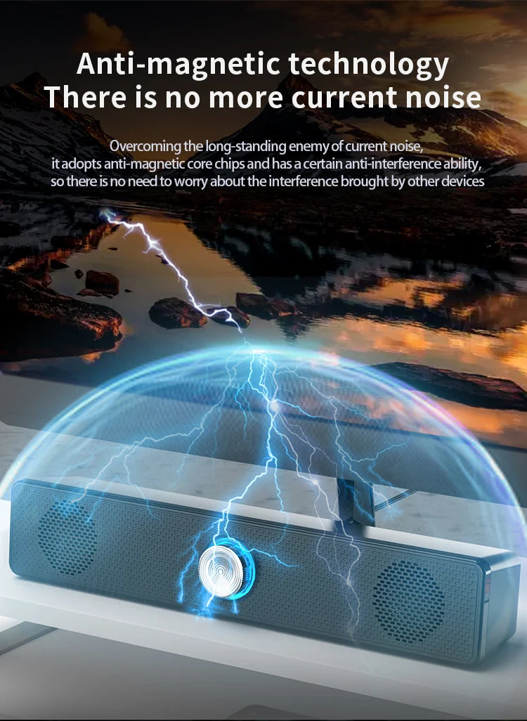 Sleek black USB stereo soundbar with a central volume dial, featuring anti-magnetic technology to prevent interference.