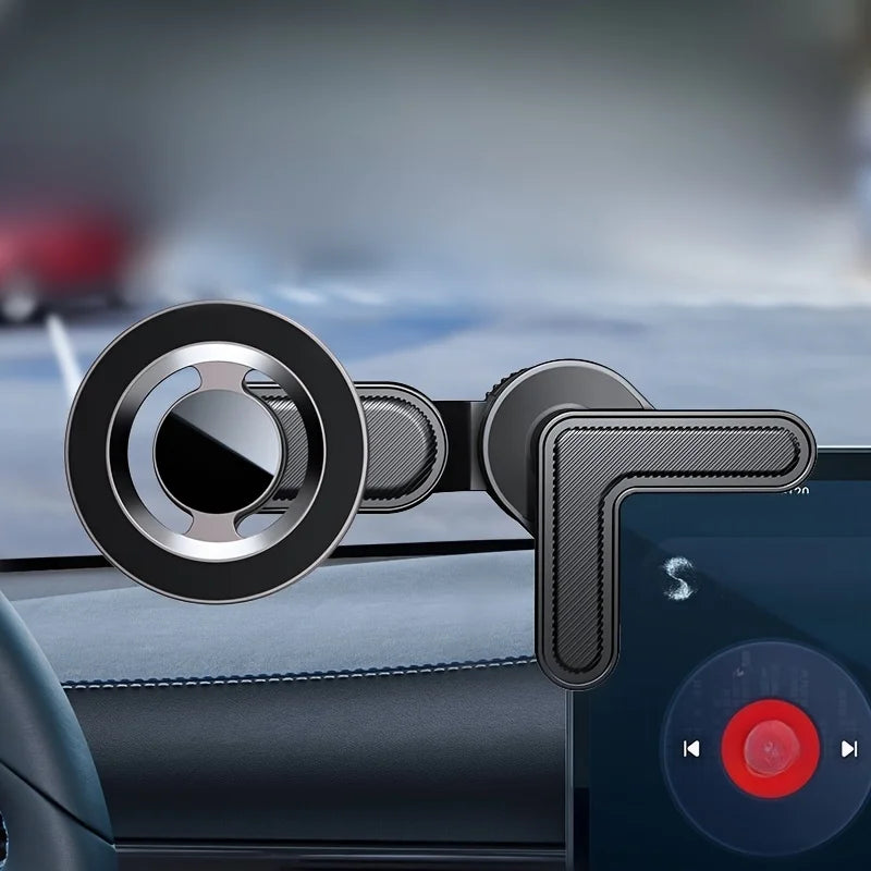 Black magnetic car phone mount with an L-shaped arm and a circular silver-accented magnetic base on a vehicle dashboard.