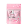 Pink skincare gift set including serum, eye cream, and essence cream in a convenient floral-themed travel pouch.