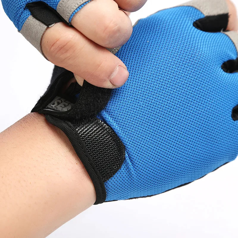 Close-up of a blue fingerless sports glove with grey trim and a black velcro wrist strap.