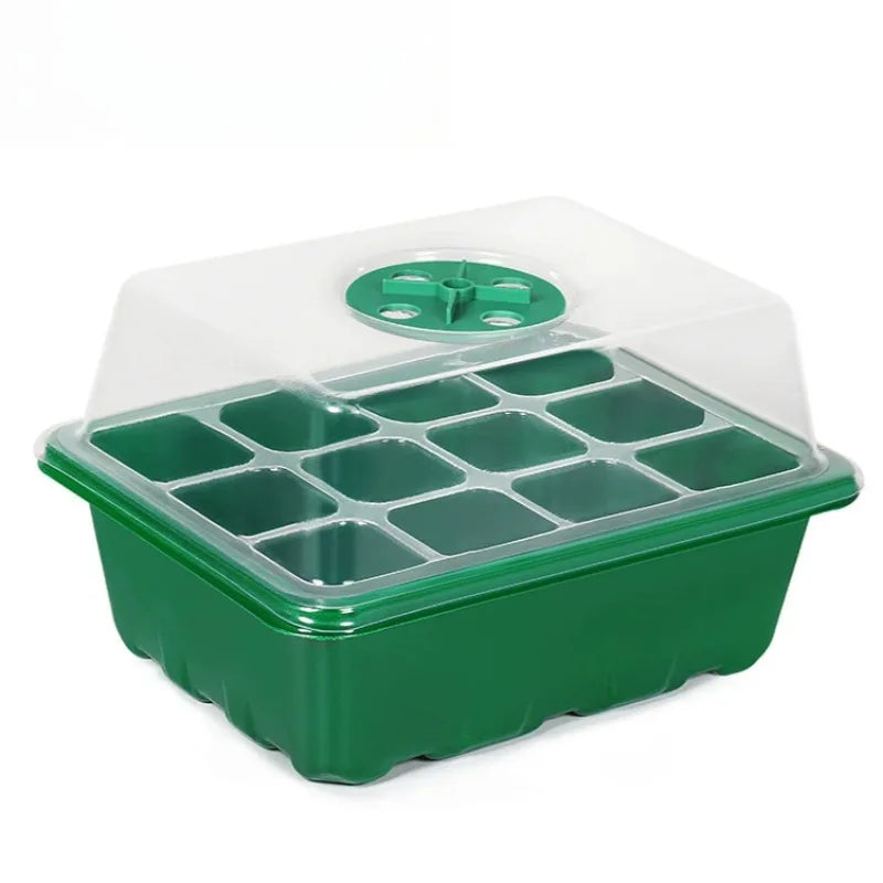 Green plastic 12-cell seedling starter tray with a clear dome lid featuring an adjustable circular air vent.