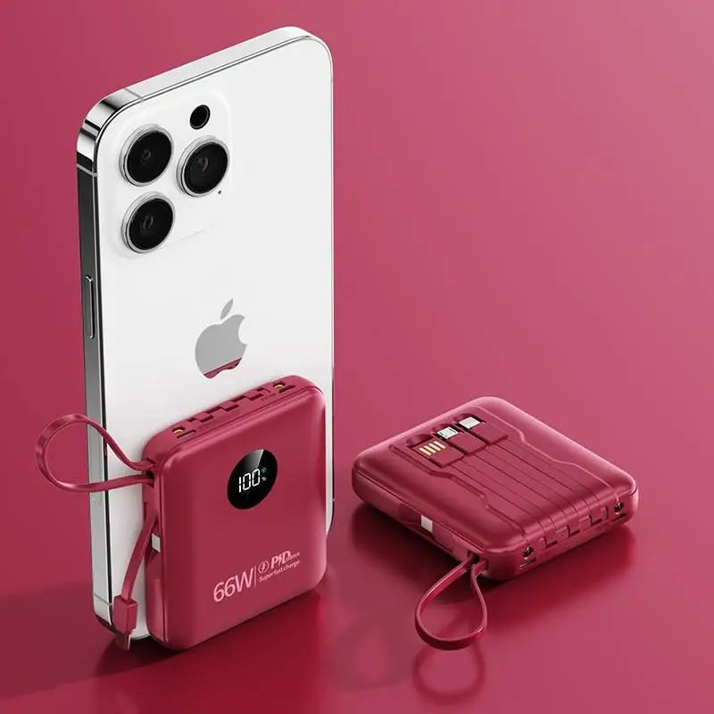 Two compact red power banks with integrated cables and LED digital displays, one charging a smartphone.