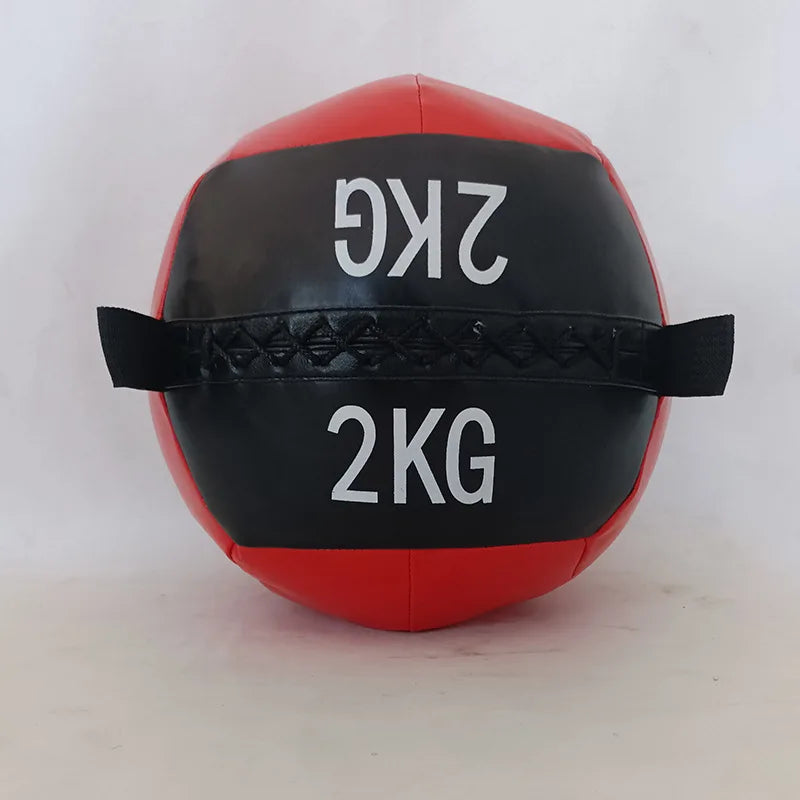 Red and black medicine ball with "2KG" printed on the black band and two side handles.