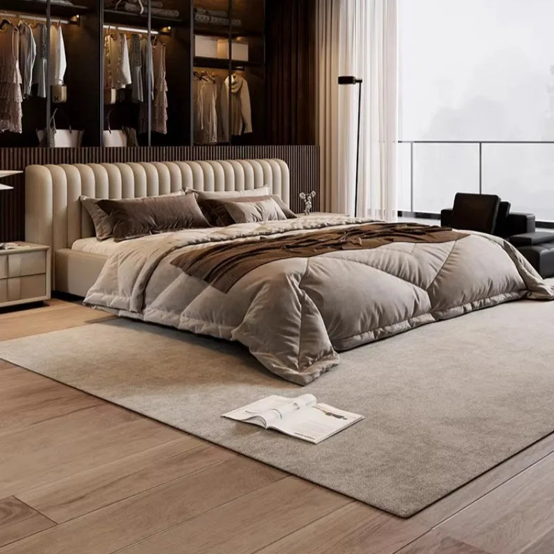 Modern cream storage bed frame with a curved, vertical-panelled headboard, styled in a contemporary bedroom.