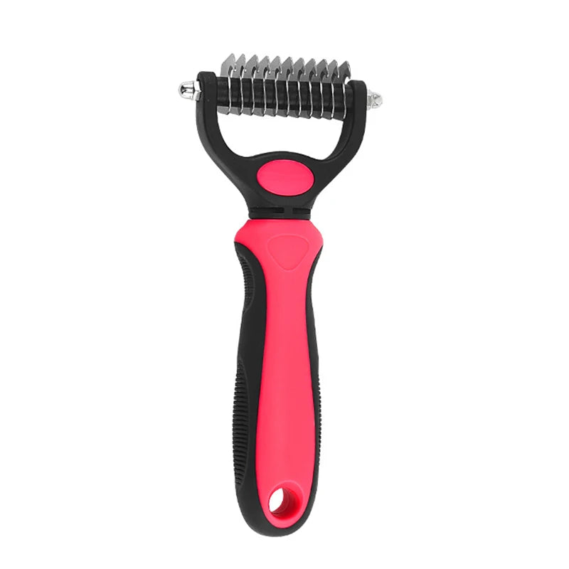 Pink and black de-shedding grooming rake for pets with dual-sided stainless steel blades and an ergonomic handle.