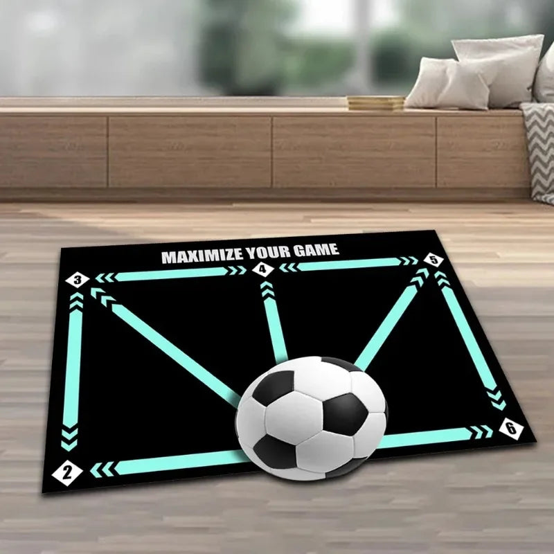 Black football training mat with light blue numbered directional arrows and "MAXIMIZE YOUR GAME" text on a wooden floor.