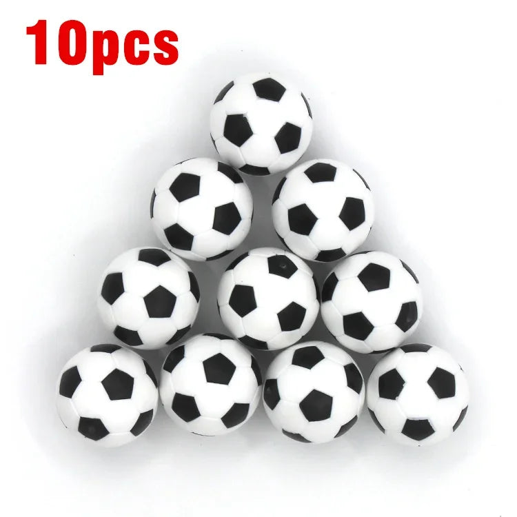 A pack of 10 small, classic black and white football-patterned sports balls arranged in a triangle.