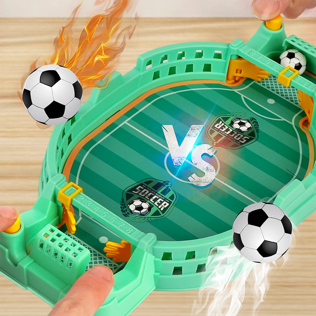 Tabletop mini football game in green with two goals, score trackers, and two small black and white soccer balls.