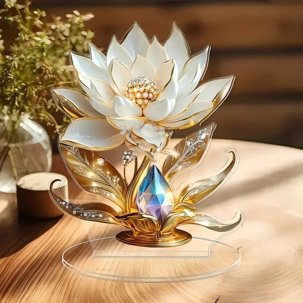 Decorative acrylic lotus flower ornament in white and gold, featuring a sparkling crystal centre on a round base.