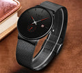 Elegant ultra-thin watch with a black dial, red accents, and a matching black stainless steel mesh strap.