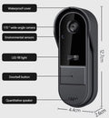 A sleek black wireless video doorbell featuring a wide-angle camera, LED light, sensors, and built-in speaker.