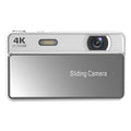 Silver digital camera with a sliding cover, 4K Ultra HD lens, and built-in flash on a rectangular metal body.