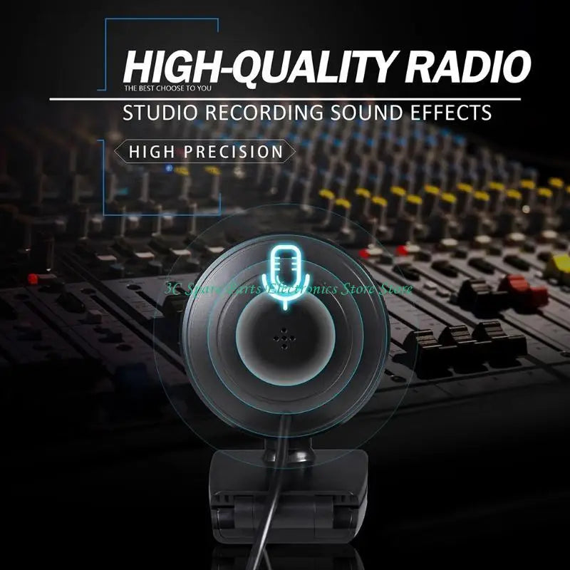 A black circular plastic computer microphone with a mounted base, displayed over an out-of-focus audio mixing console.