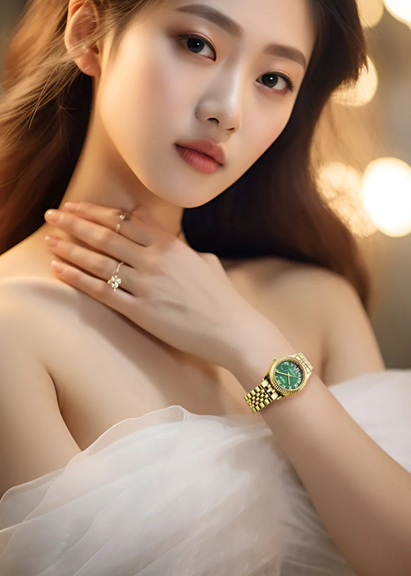 A woman wearing an elegant ladies' gold-tone quartz watch with a striking emerald green circular dial.