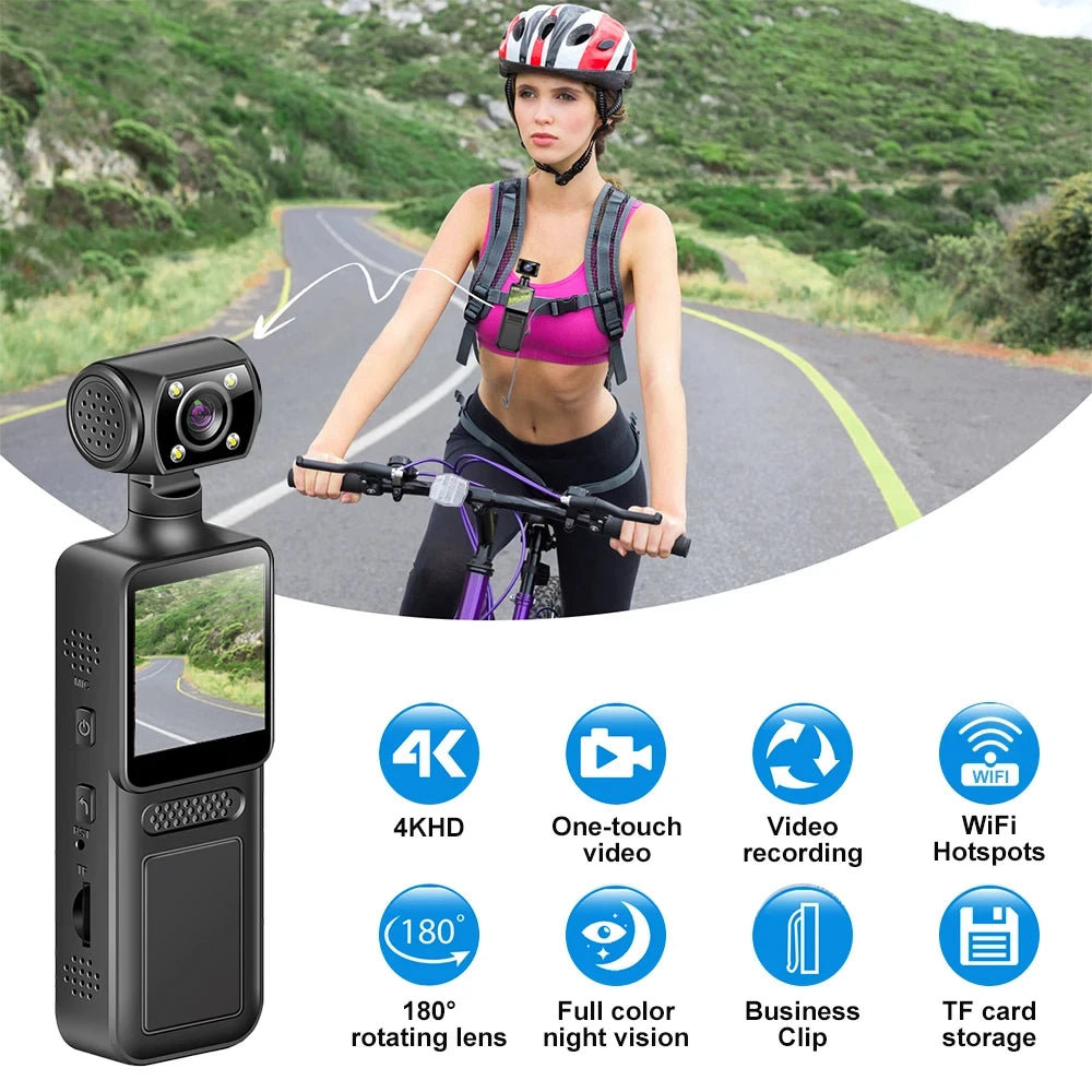 Black plastic 4K body-worn video camera with a 180-degree rotating lens, screen, and clip, worn by a female cyclist.