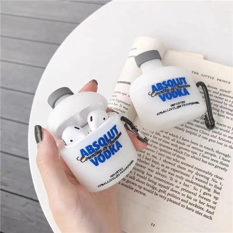 White silicone AirPod case shaped like an Absolut Vodka bottle with blue branding. Compatible with standard AirPods.