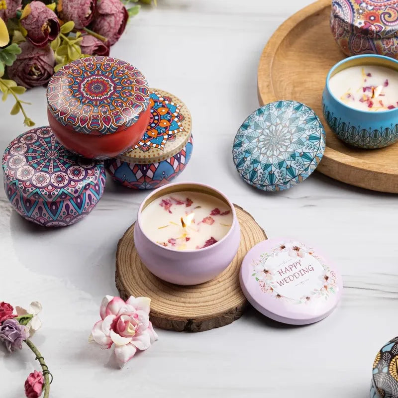 Set of colourful metal candles with intricate mandala patterns and floral designs, including a 'Happy Wedding' tin.
