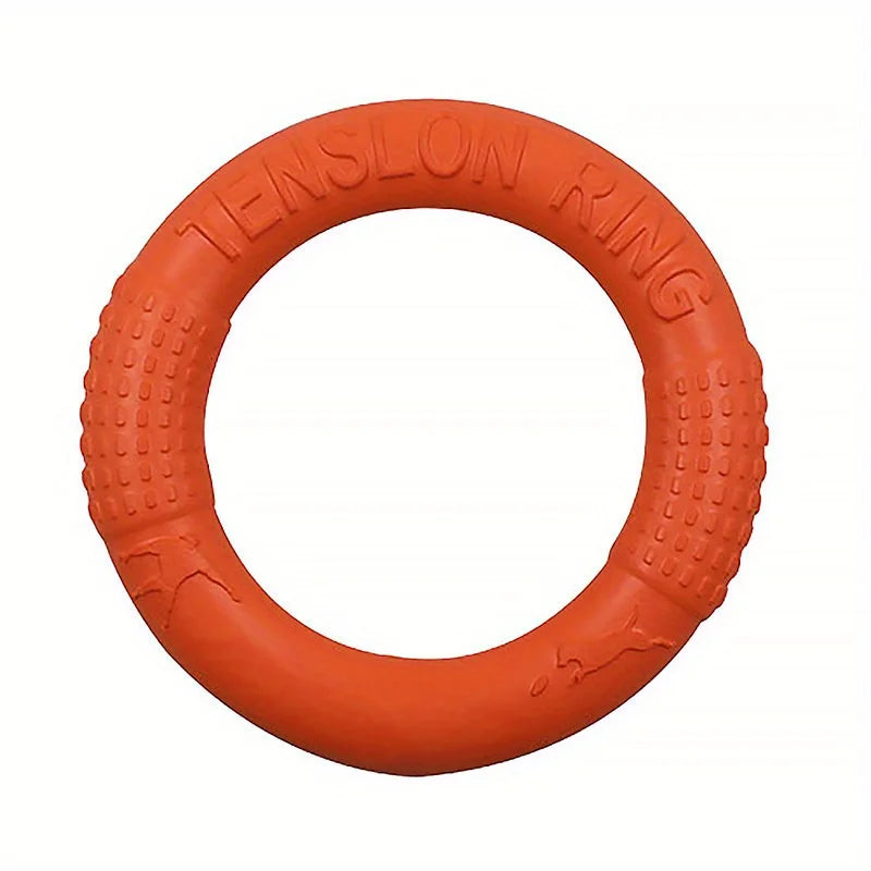 Bright orange, durable EVA foam dog training ring with textured grip sections and embossed dog silhouettes.
