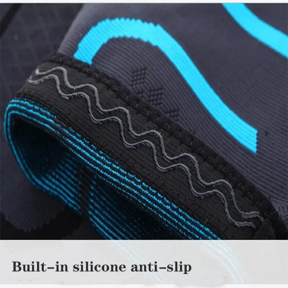 Dark grey and bright blue elastic knee support brace with a wavy silicone anti-slip strip.