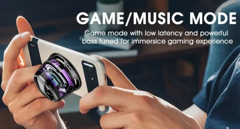 Compact black portable Bluetooth speaker with vibrant RGB lighting, attached to a smartphone for gaming.