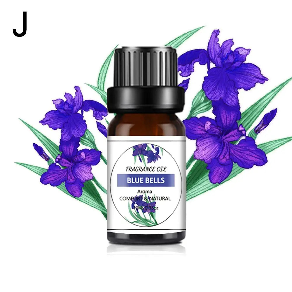 10ml amber glass bottle of Blue Bells fragrance oil with a black cap, set against a background of purple flowers.