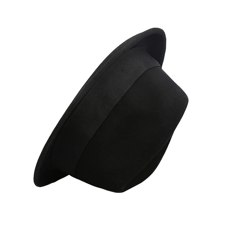 Classic black unisex wool felt fedora with a matching grosgrain ribbon trim, shown from an angled side view.