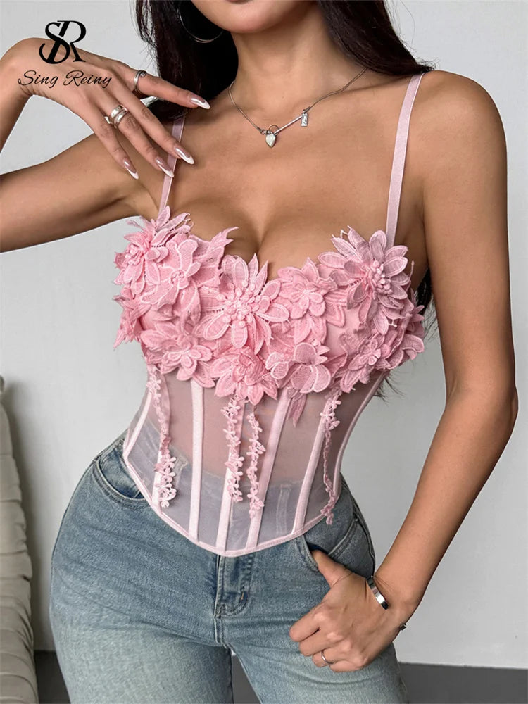Pink sheer gauze corset top with thin straps and 3D floral lace appliques across the sweetheart neckline.
