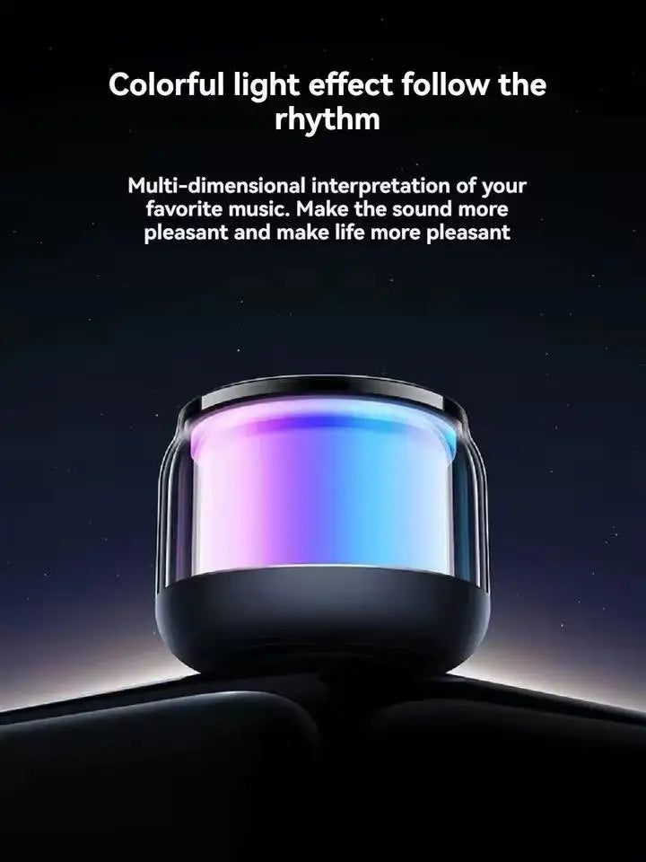 Compact black wireless speaker with a glowing, multi-coloured LED light display.