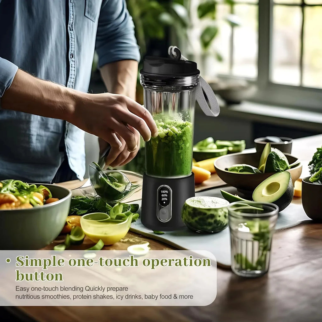 Portable black blender with a digital display and carrying strap, blending green ingredients in a kitchen setting.
