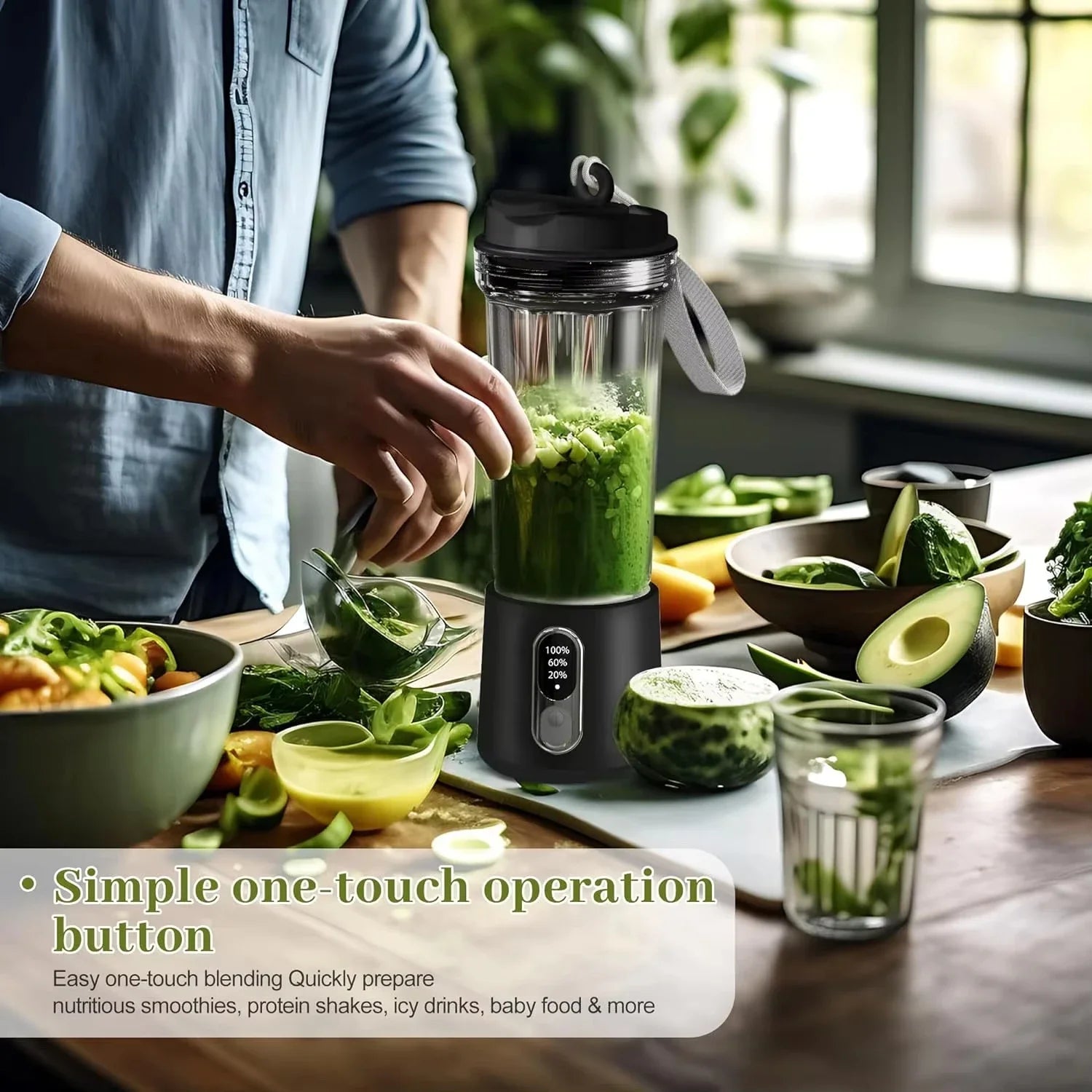 Portable black blender with a digital display and carrying strap, blending green ingredients in a kitchen setting.