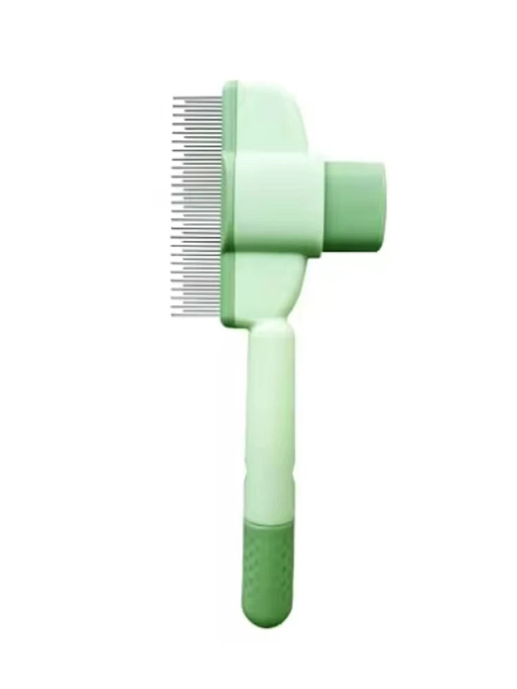 Sage green pet grooming brush with fine metal teeth and an ergonomic handle.