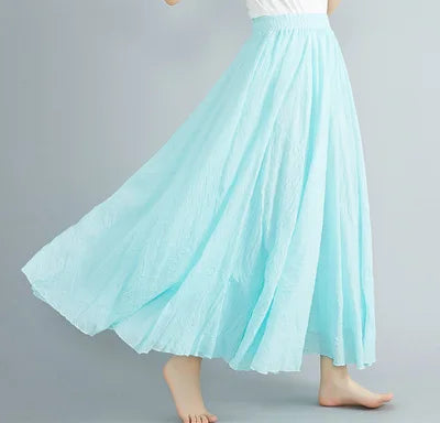 Flowing light blue maxi skirt with an elasticated waistband and crinkled texture, perfect for a breezy, relaxed look.