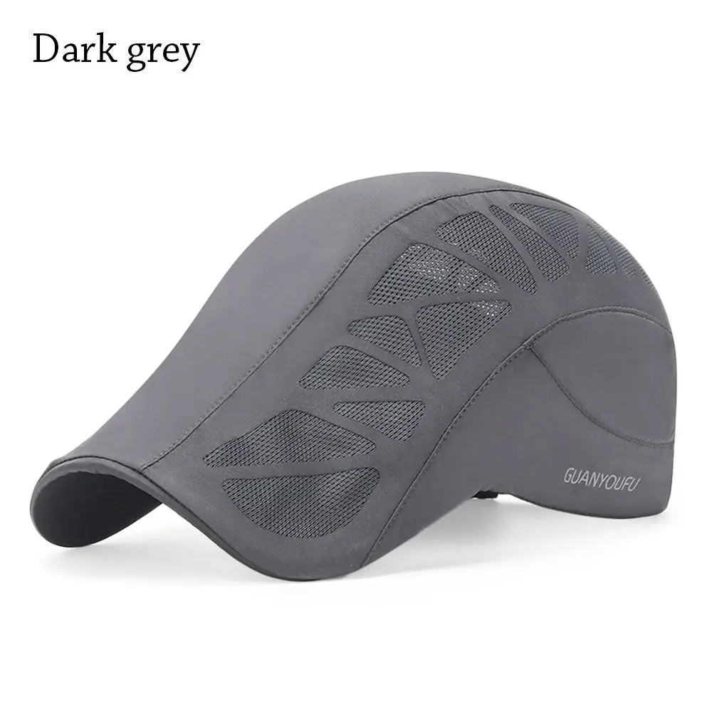 Dark grey men’s flat cap featuring a modern geometric mesh panel design for breathable style.