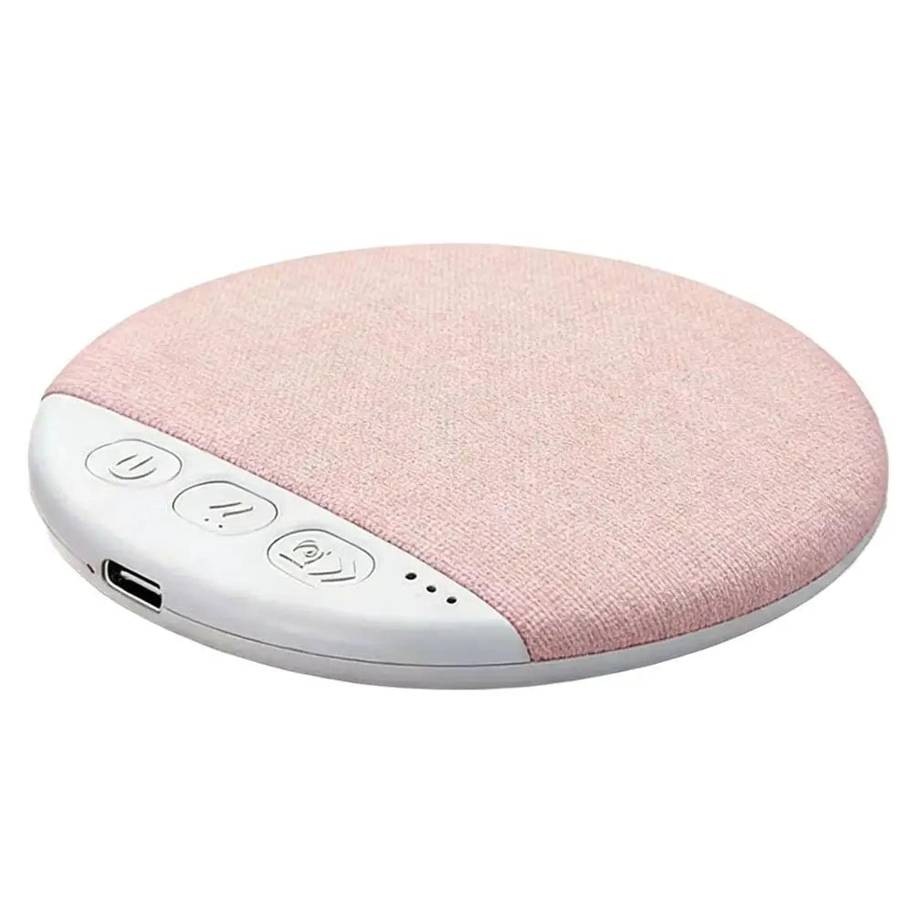 Round, blush pink fabric-covered Bluetooth sleep speaker with a white control panel and USB charging port.