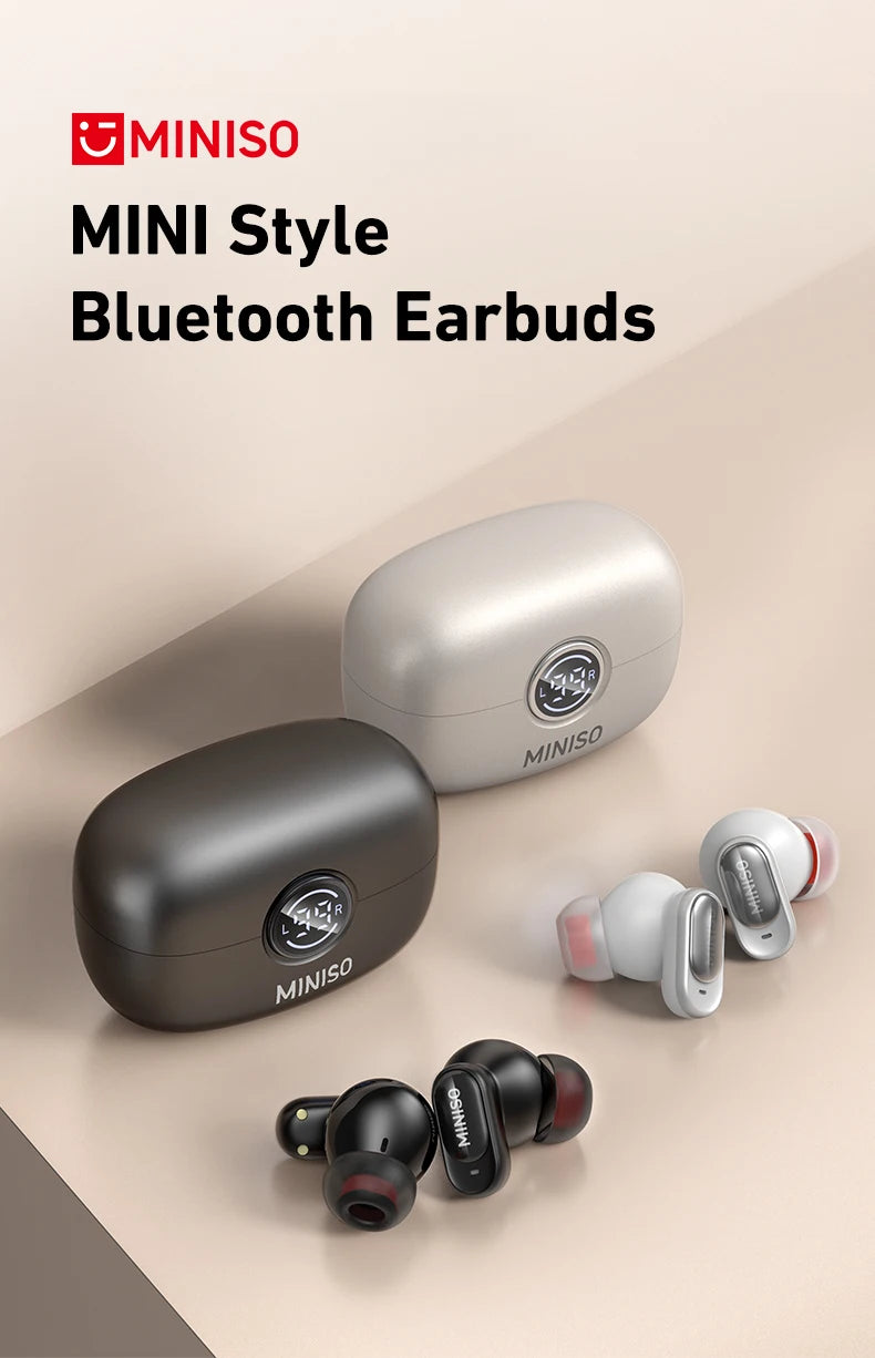 Black and silver wireless earbuds with matching oval charging cases, featuring a minimalist, sleek design.