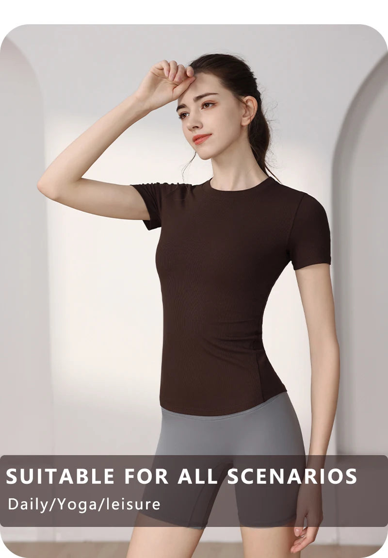 Woman wearing a fitted, dark brown short-sleeve ribbed t-shirt, suitable for yoga, sports, or casual wear.