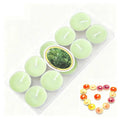 Pack of apple-scented light green tea light candles, displayed with a small heart arrangement of colourful tea lights.