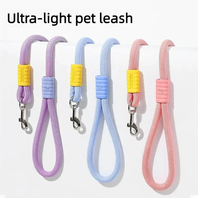 A set of ultra-light, colourful braided rope dog leads in lilac, blue and pink with contrasting silicone handle grips.