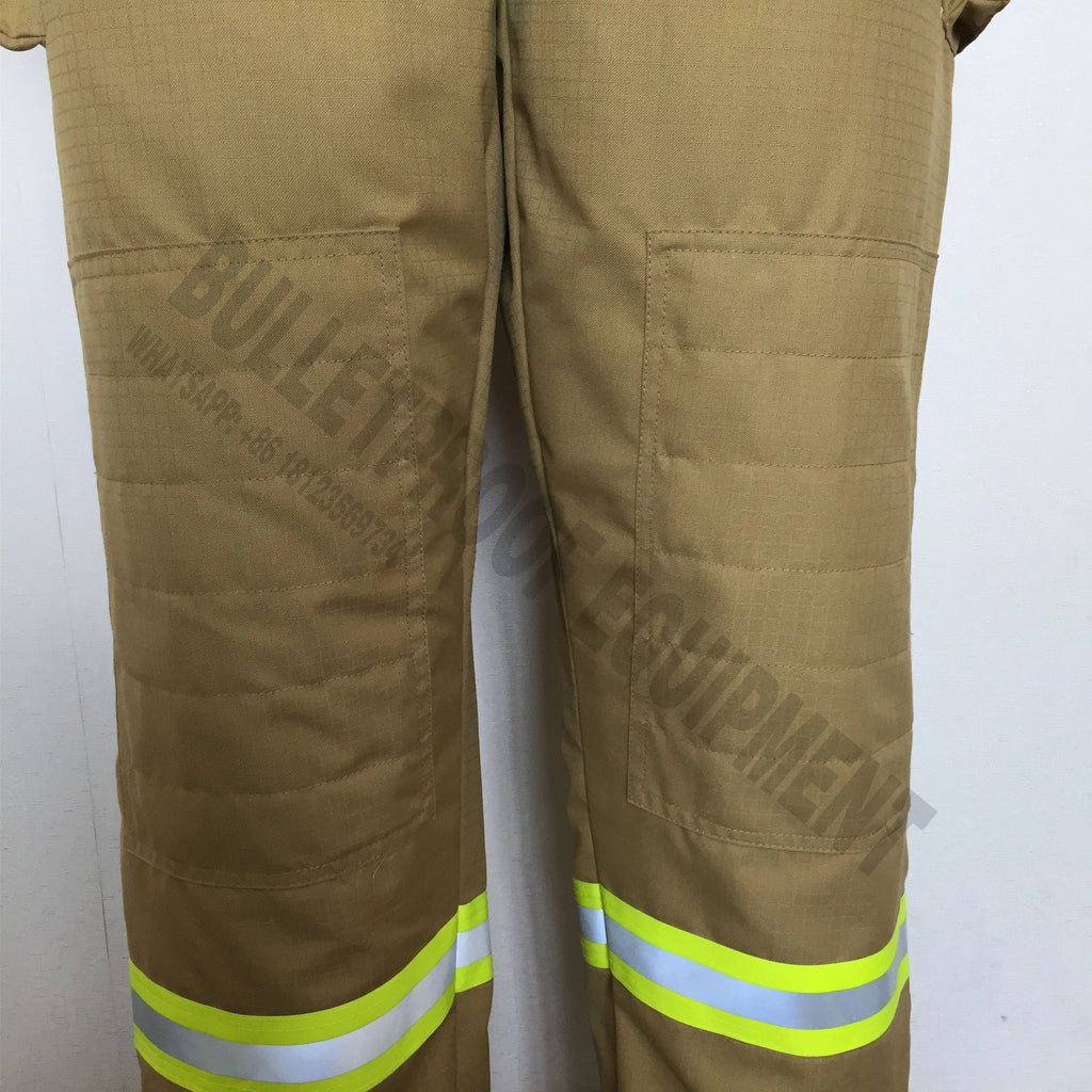 Tan firefighter pants with reinforced quilted knee patches and reflective yellow and silver safety strips at the ankles.