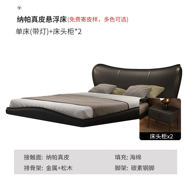 Modern black leather floating bed frame with a curved headboard and two matching bedside tables.
