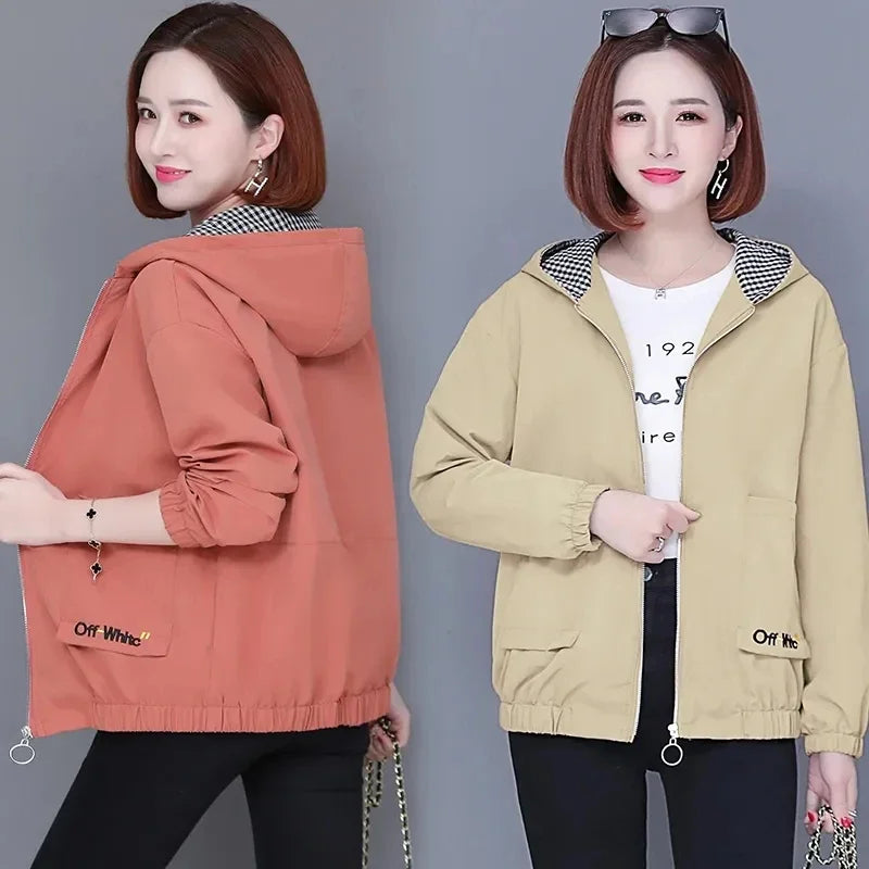 Women wearing casual, hooded zip-up jackets in coral and beige with a black-and-white checkered inner lining.