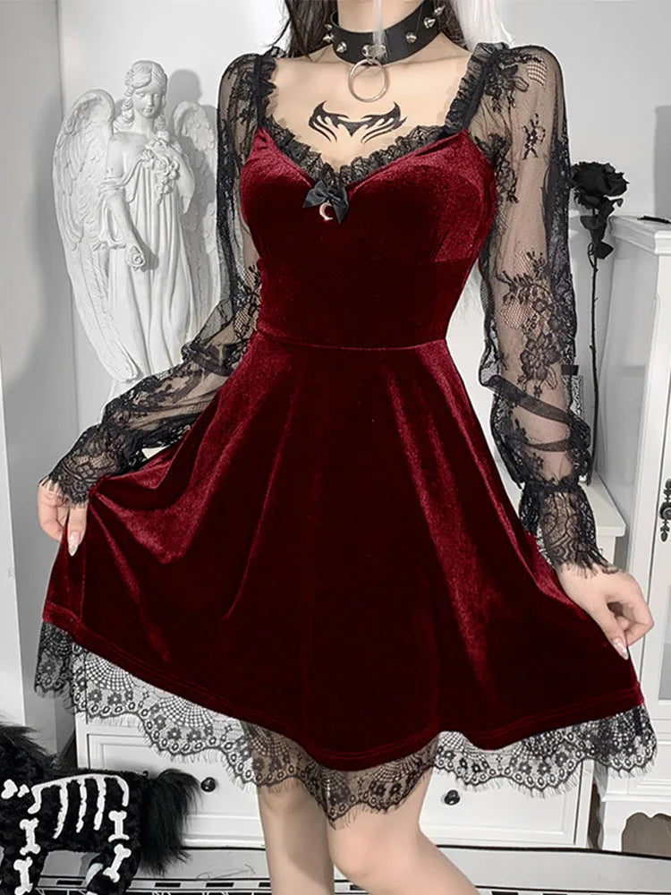Red velvet A-line mini dress with sheer black lace long sleeves, V-neck, and black lace trim at the hem.