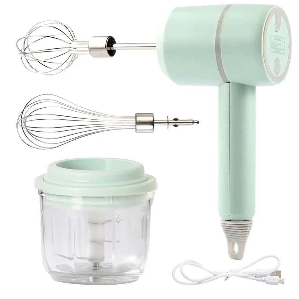 Light green electric handheld mixer with two whisks, a clear blending bowl, and a USB charging cable.
