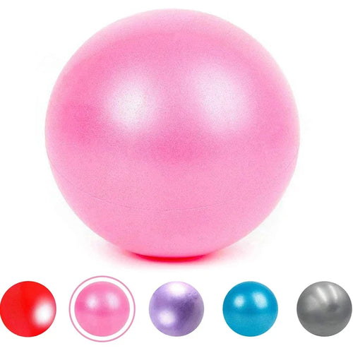 A pink mini exercise ball for yoga or pilates, shown with colour options in red, purple, blue, and grey below.