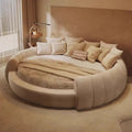 A minimalist, arched wooden bedside table with a sleek black lamp, styled next to a modern round cream bed.