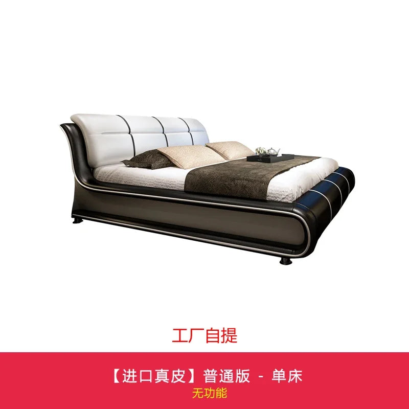 Modern black and cream leather bed frame with a sleek, curved design and panelled headboard.