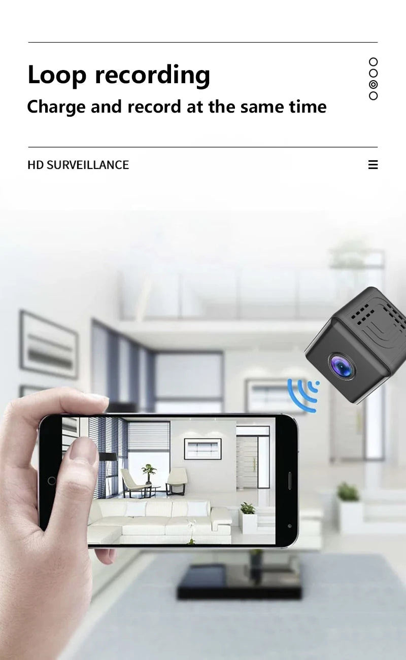 A small, black cube-shaped wireless indoor security camera shown streaming live video to a smartphone.