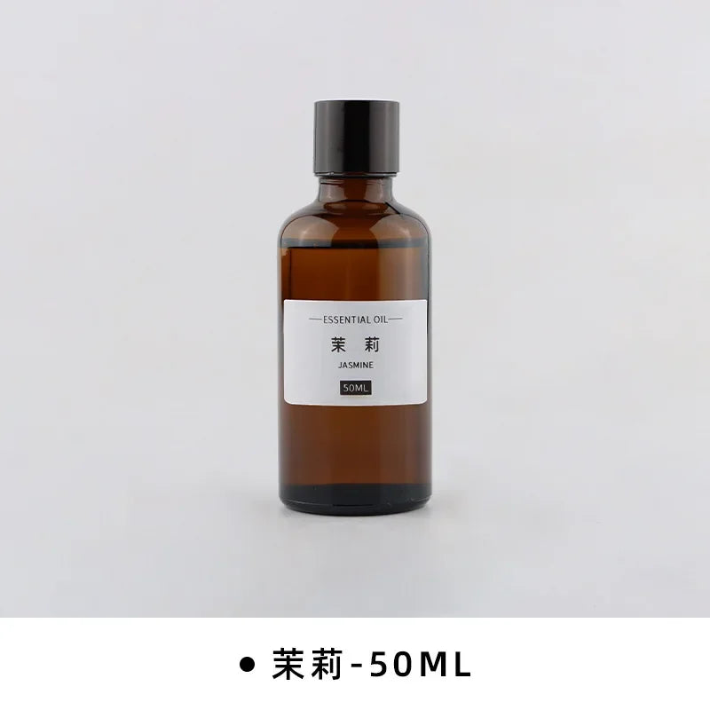 50ml bottle of Jasmine essential oil in an amber glass apothecary bottle with a black screw cap and minimalist label.